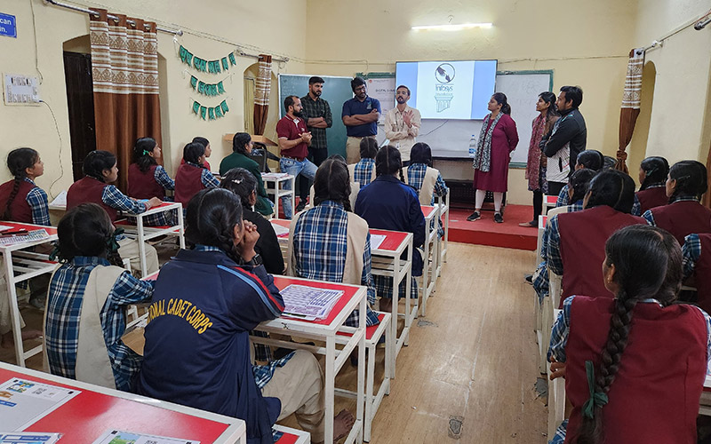Infosys volunteers having an interaction session with school children on ‘coding without computers’